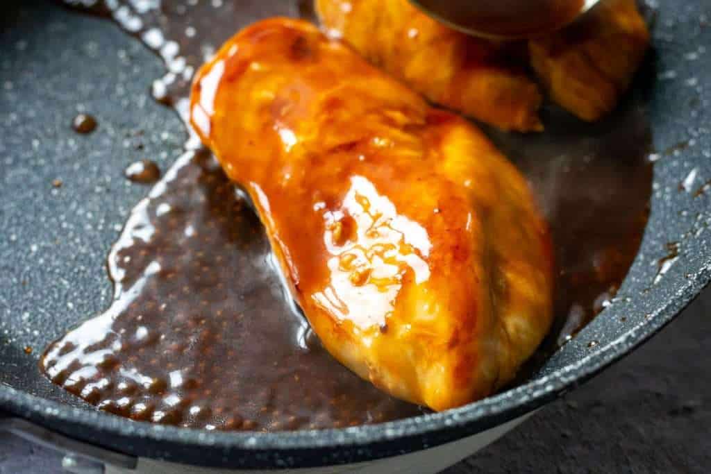 Chicken breasts coated in teriyaki sauce.