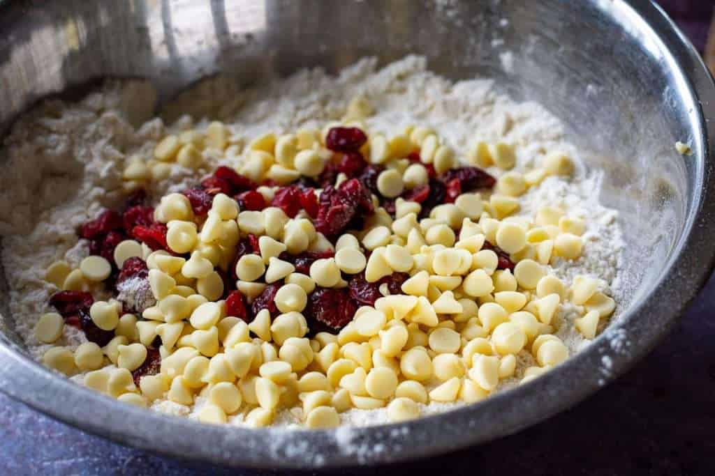 White chocolate chips and dried cherries added to the flour and butter mixture.
