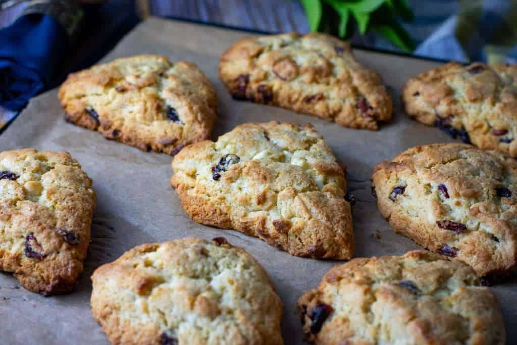 Cherry scones cooling on a baking sheet.