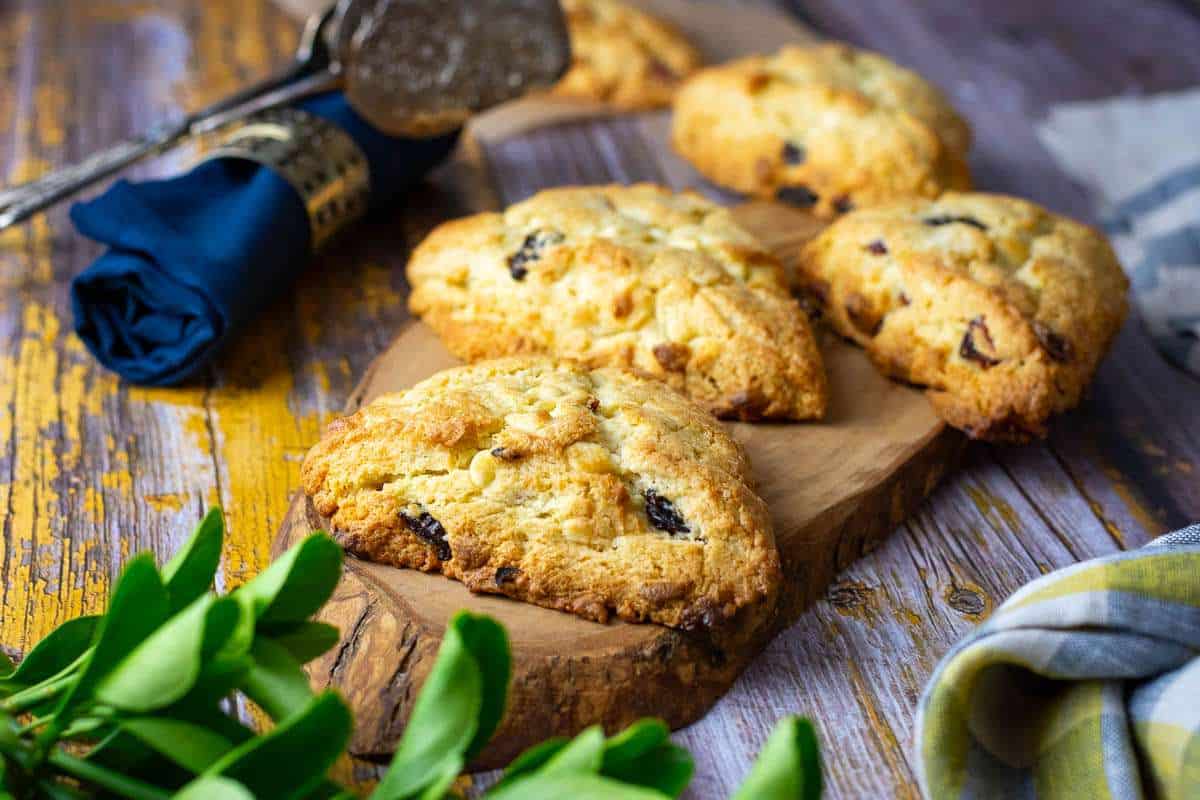 White Chocolate Cherry Scones on a decorative wooden board.
