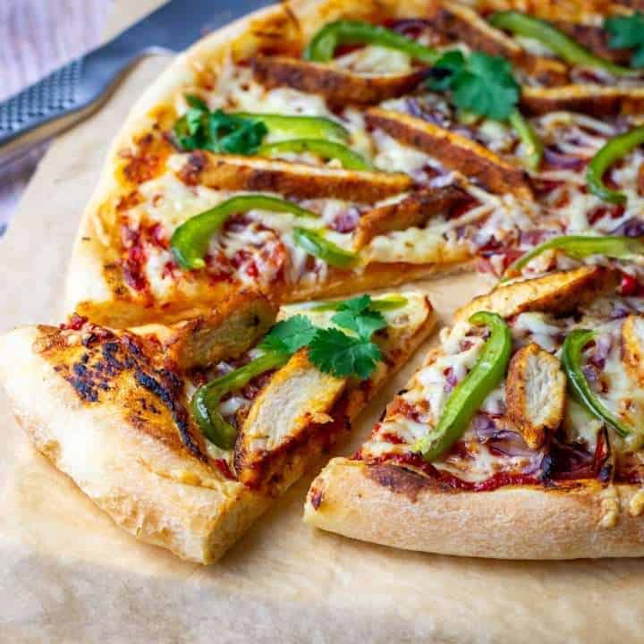 Chicken Fajita Pizza with one slice cut.