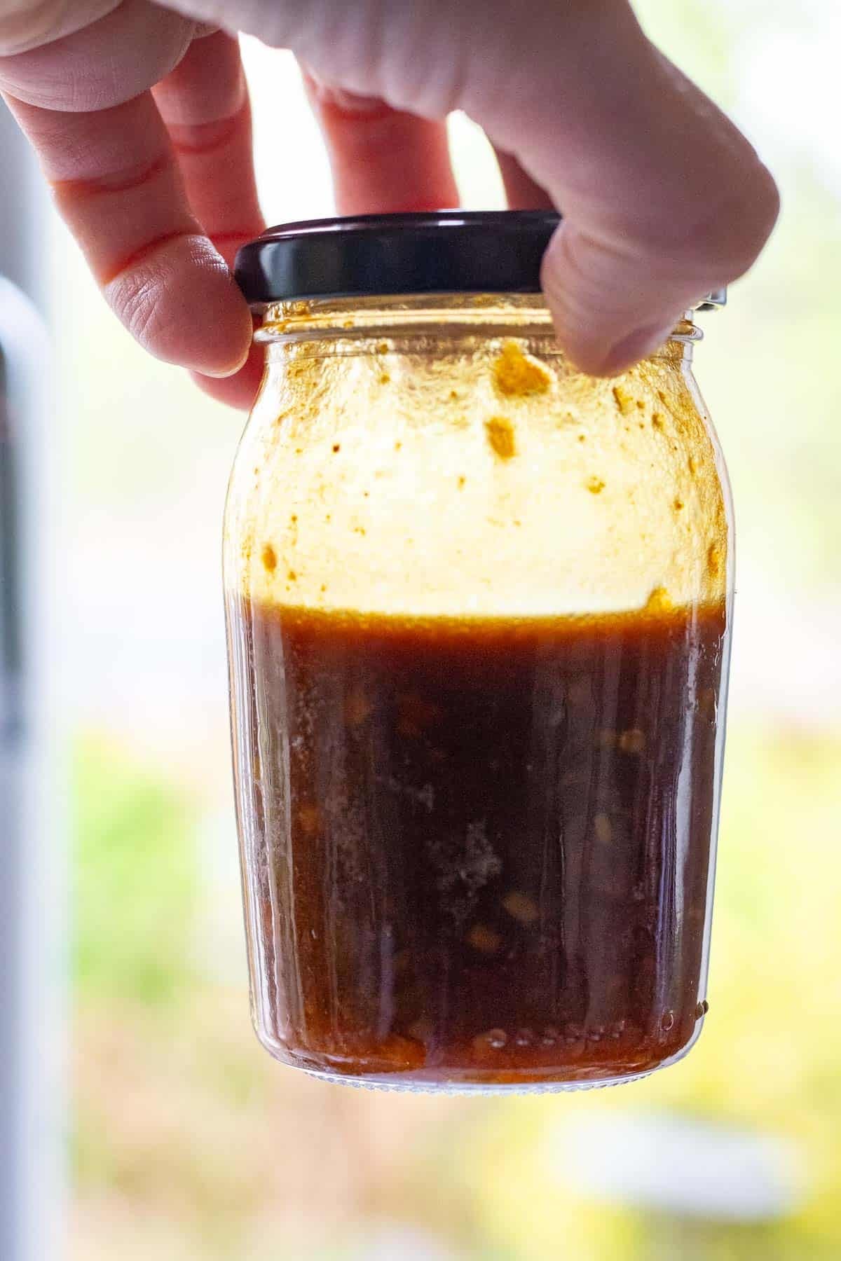 Emulsified salad dressing after shaking it.