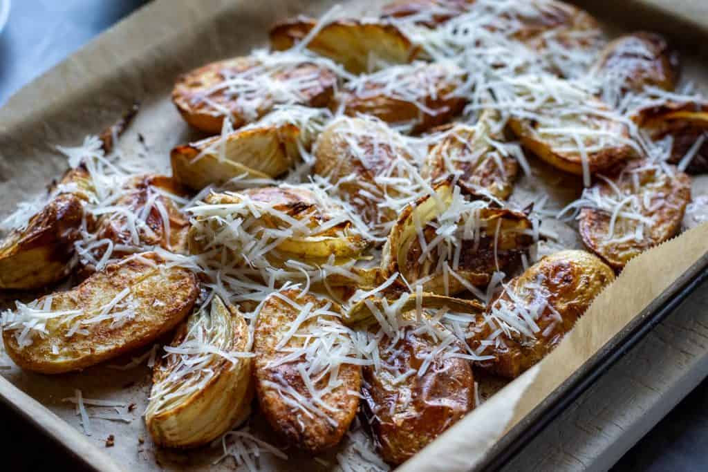 Parmesan scattered on roasted vegetables.