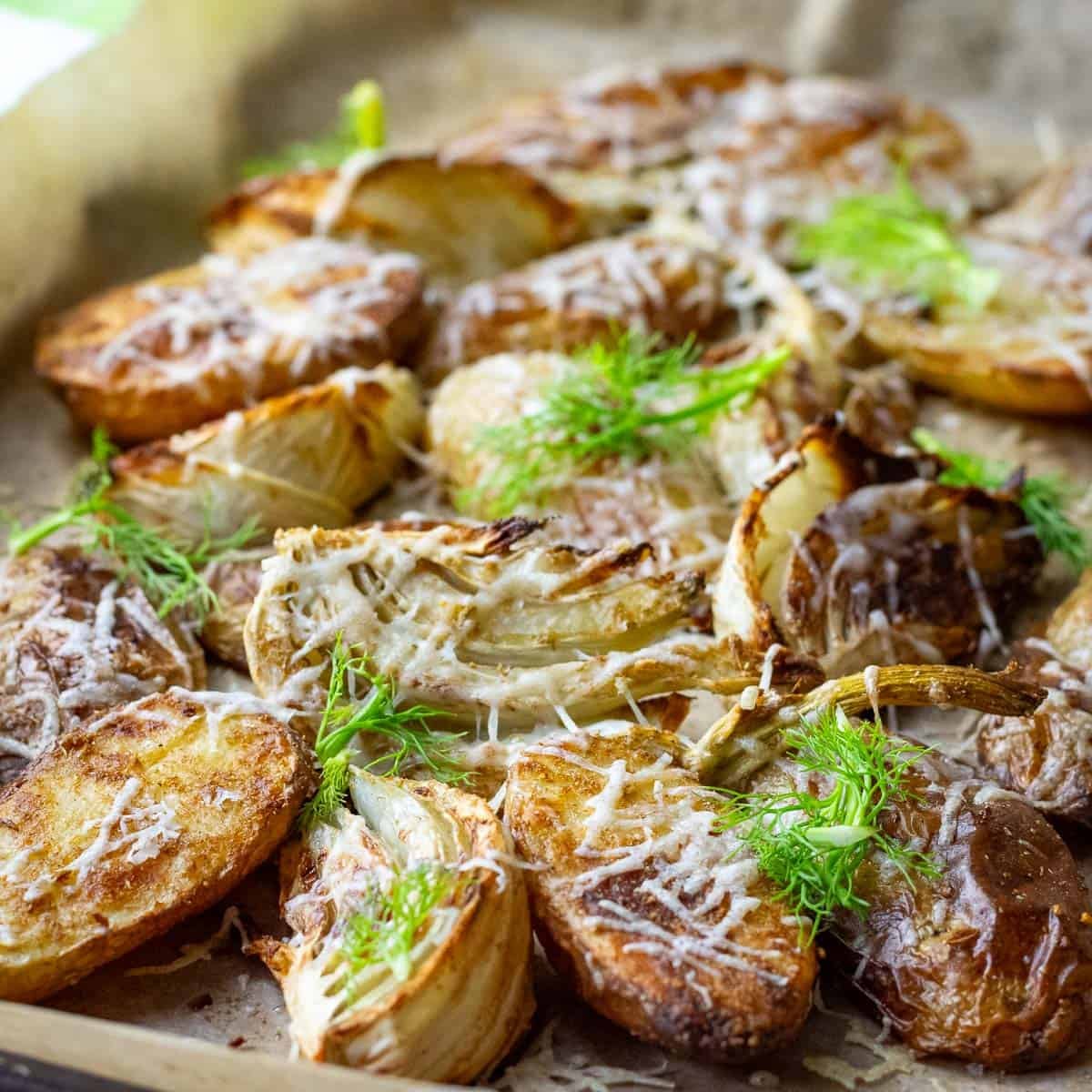 Roasted Fennel and Potatoes with fennel fronds on top.