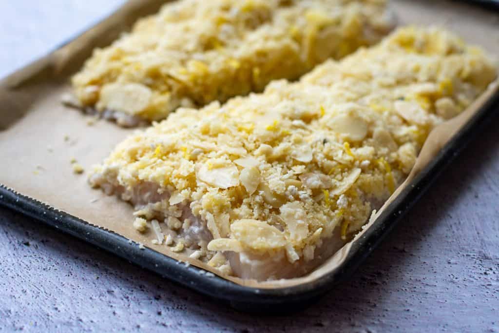Almond crust on top of the fish fillets.