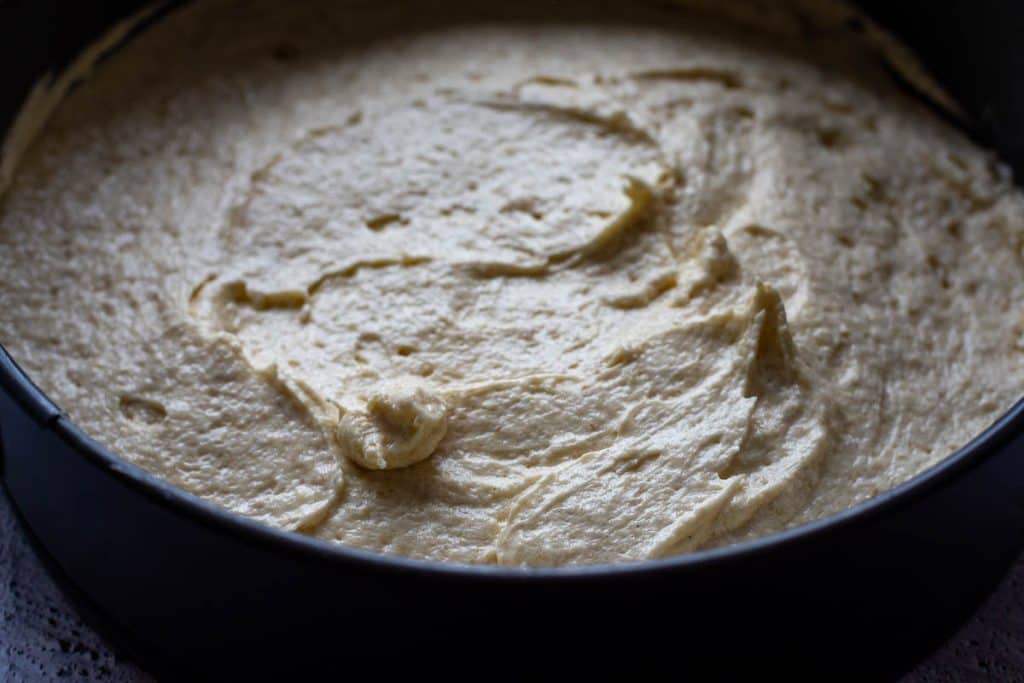 Sourdough cake batter in a springform cake tin.