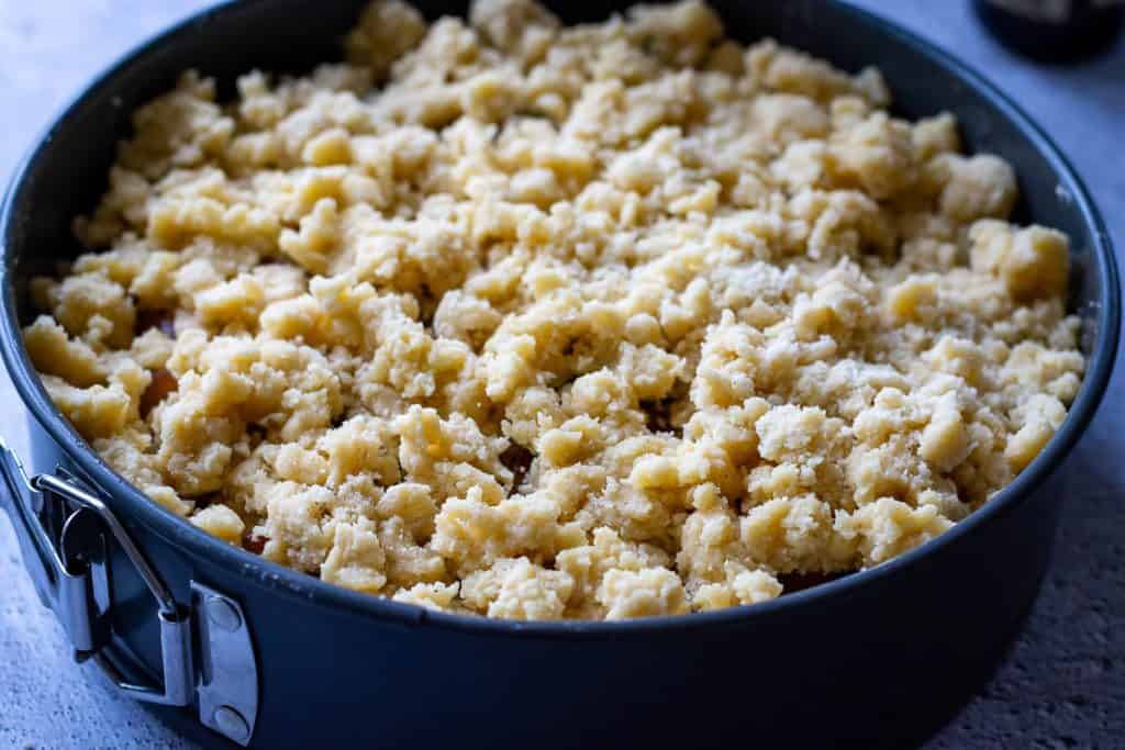 Streusel topping on top of the plums.