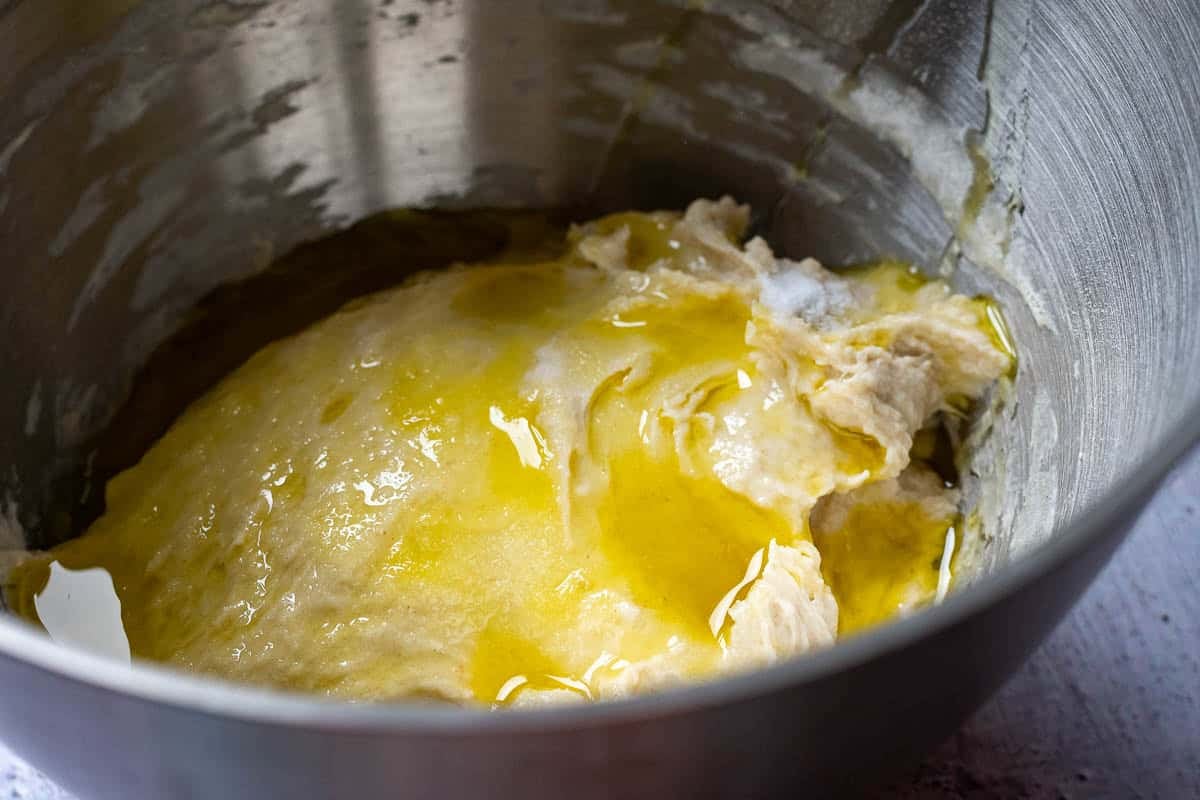 Salt and olive oil added to sourdough focaccia dough after fermentolyse.