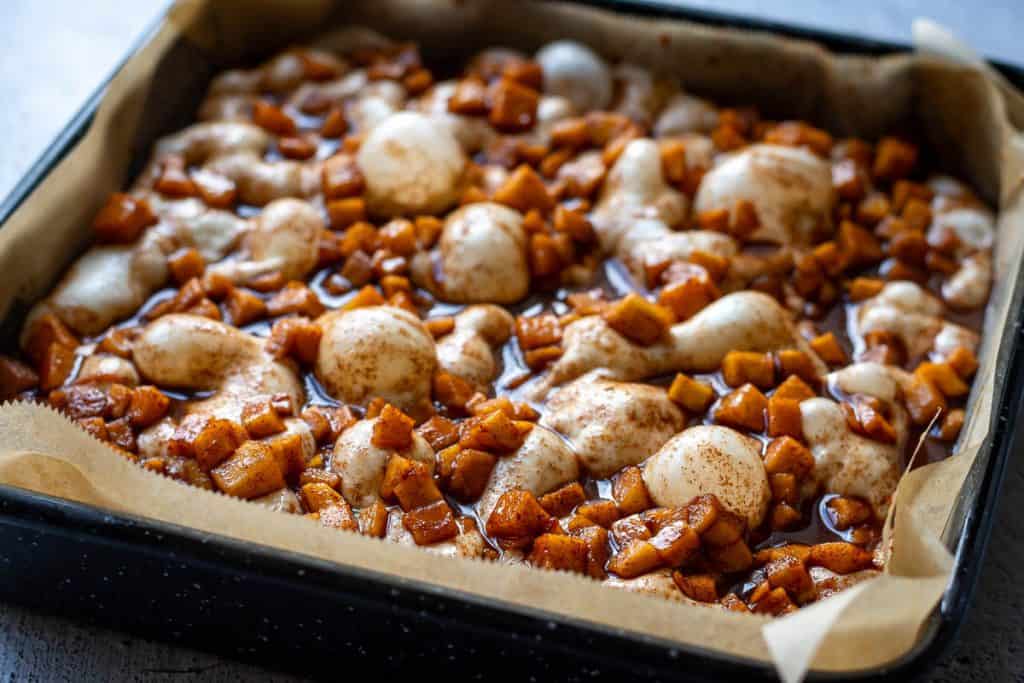 Apple Sourdough focaccia in a tray with topping ready to be baked.
