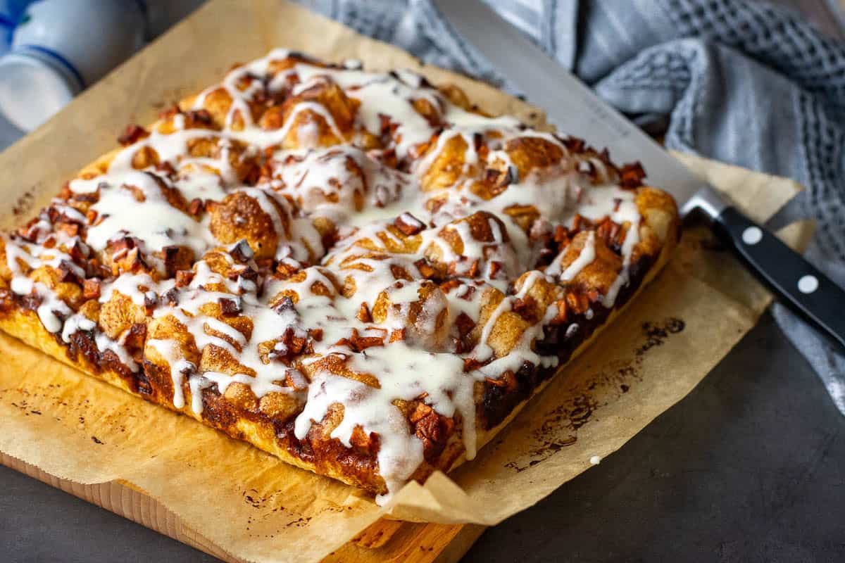 Apple Sourdough Focaccia drizzled with icing on top.