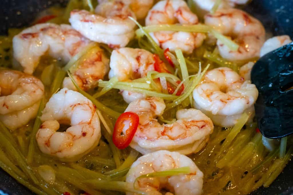 Prawns cooking with the aromatics.