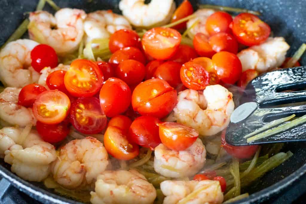 Cherry tomatoes added to the orawn pan.