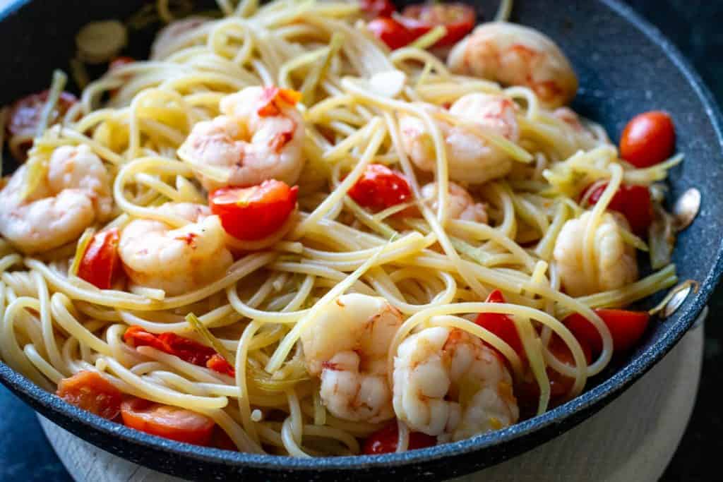 Prawns, fennel and cherry tomatoes tossed with the cooked spaghetti.