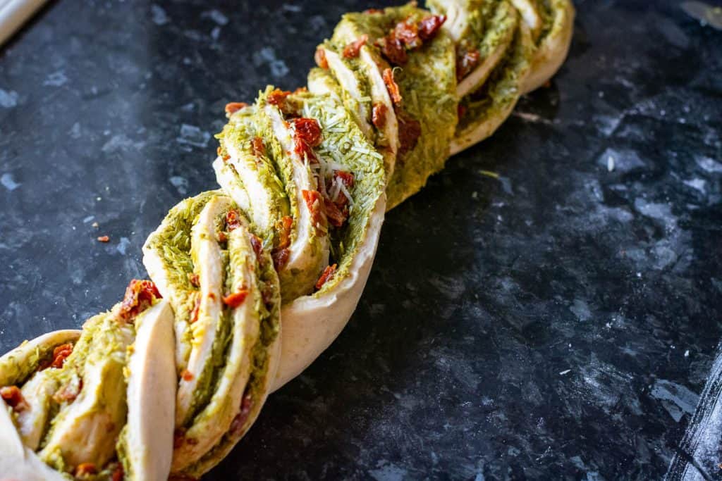 Twisted sourodugh babka with pesto and sundried tomato filling.