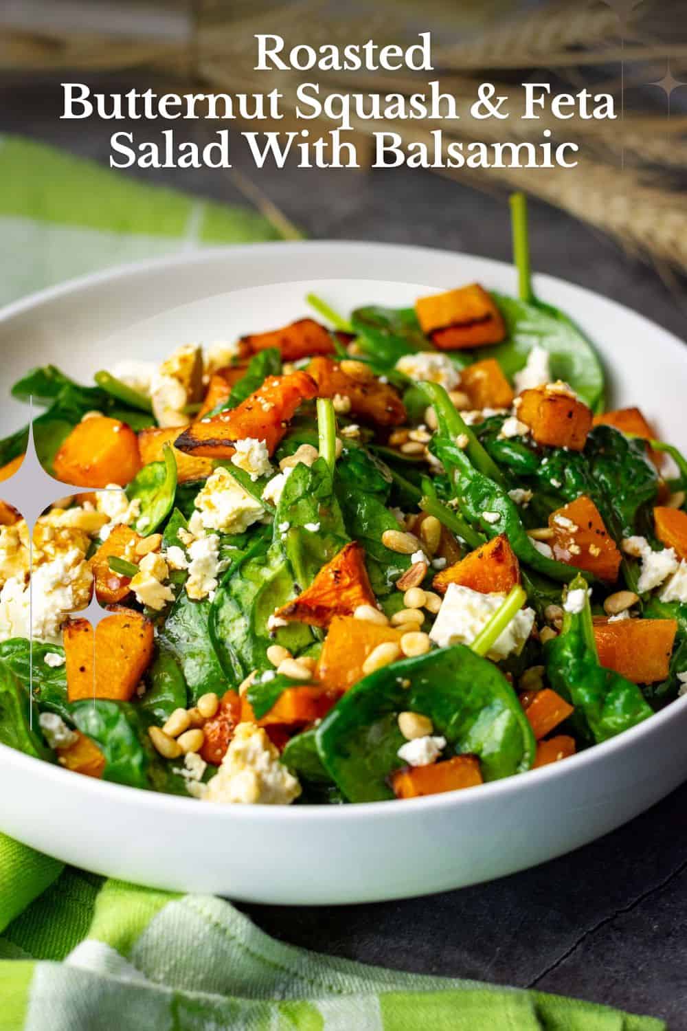 Spinach, Butternut Squash and Feta Salad in a white bowl. Pin for Pinterest.