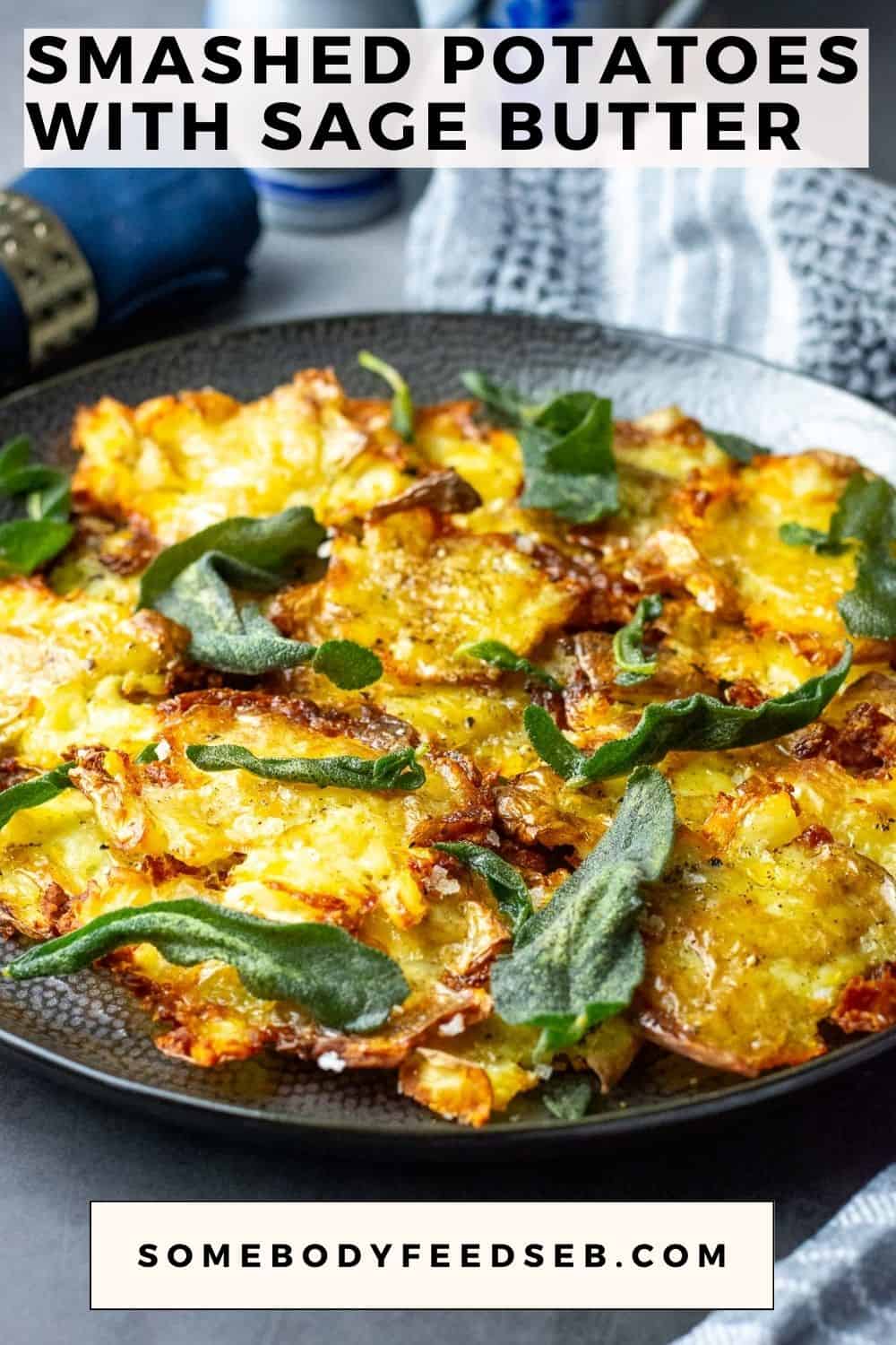 Crispy Smashed Sage Potatoes on a black plate weith crispy sage leave son top. Pin for Pinterest.