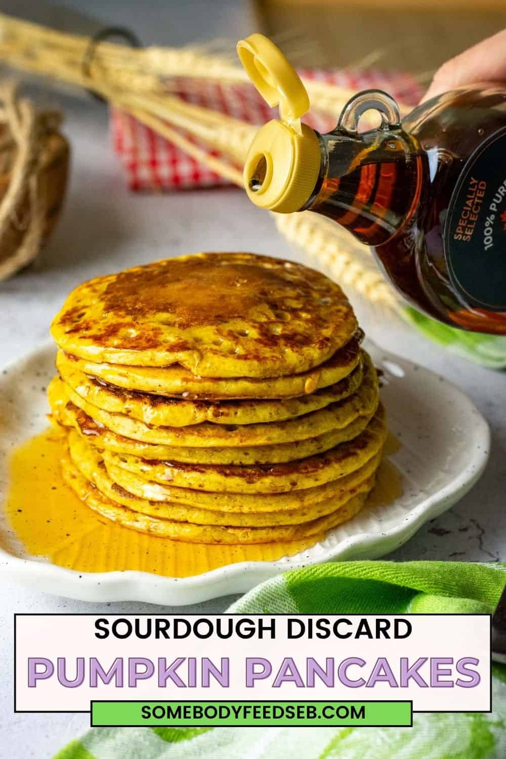 Maple syrup being poured on a stack of pumpkin sourdough pancakes. Pin for Pinterest.