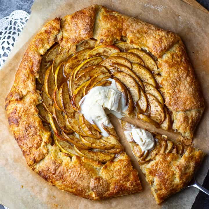 Sourdough Apple Galette with ice cream with one slice cut.