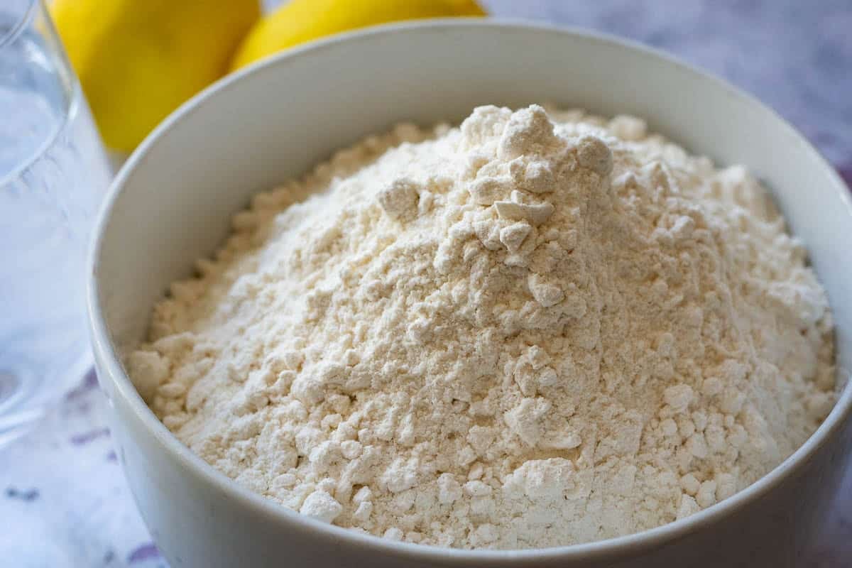 White flour in a white bowl.