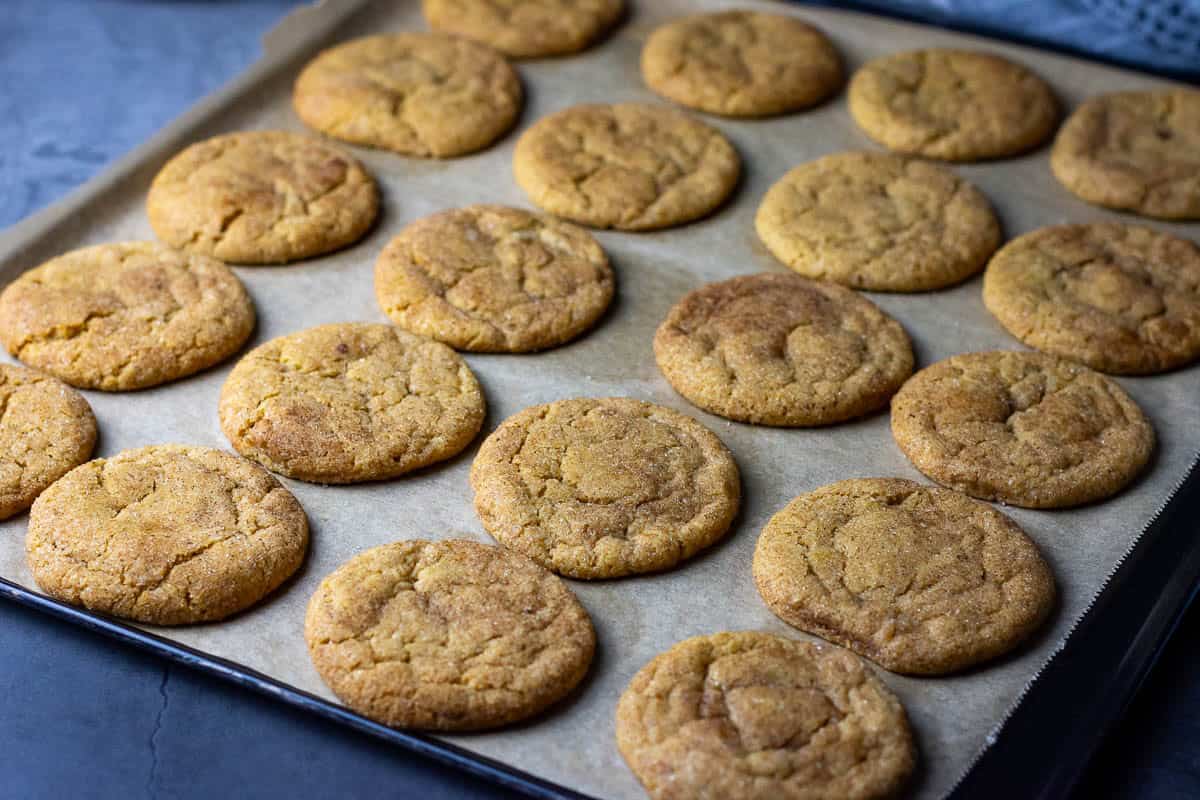 Sourdough Discard Pumpkin Snickerdoodles on a baking sheet.