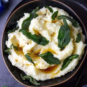 Brown Butter Sage mashed potato in a black bowl.
