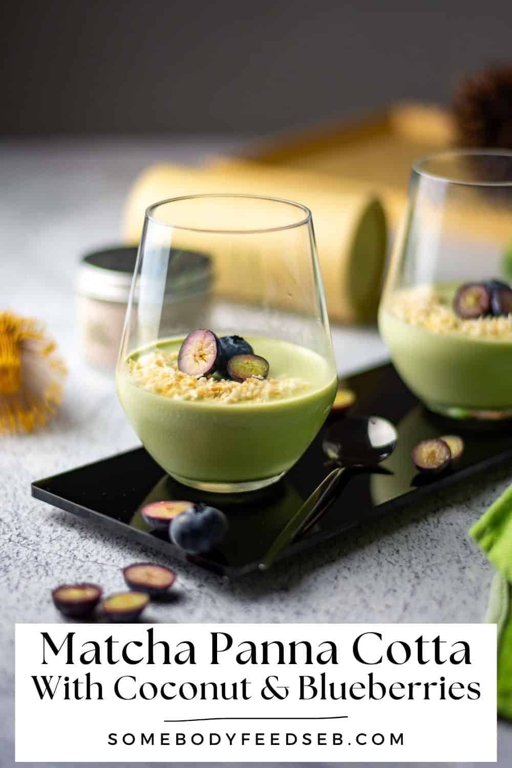 Matcha Panna Cotta in two glasses topped with blueberries and toasted coconut - Pin for Pinterest.