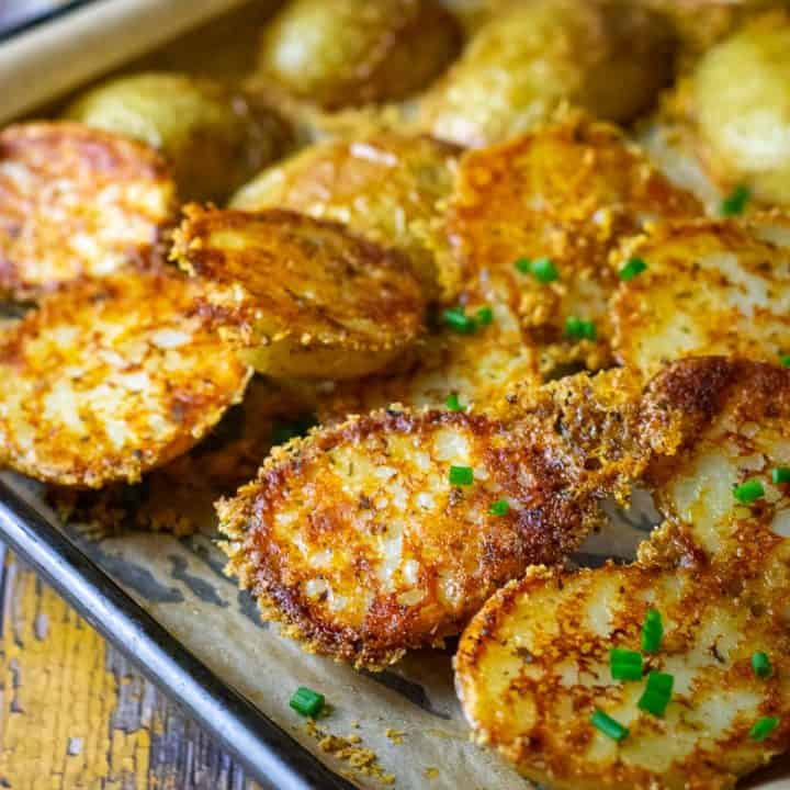 Roasted Baby Potatoes with Parmesan Cheese Crust with chives on top.