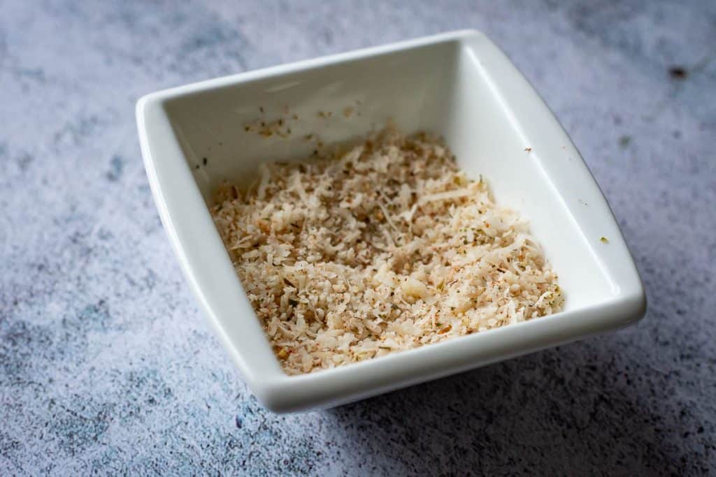 Parmesan crust ingredients in a small white bowl.