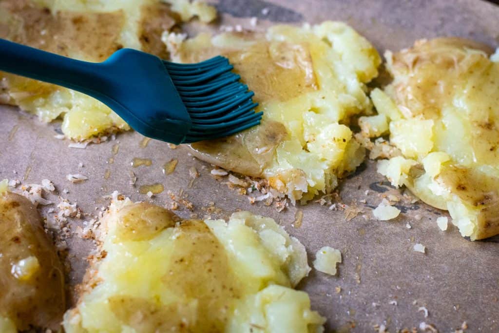 brushing potatoes with oil.