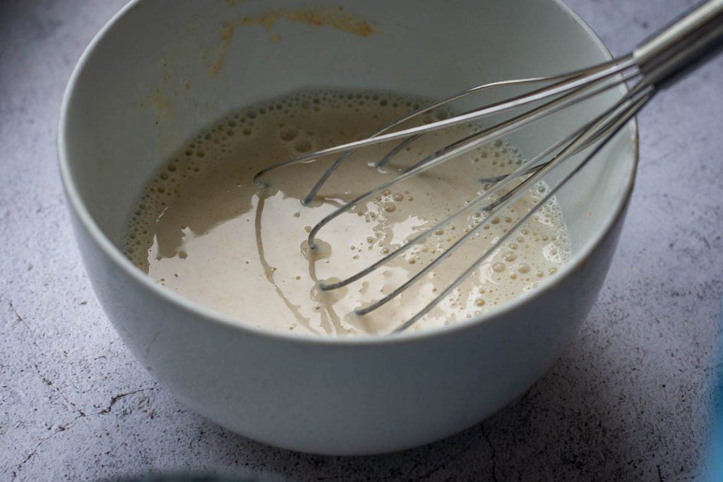 Sourdough discard whisked with a splash of milk.