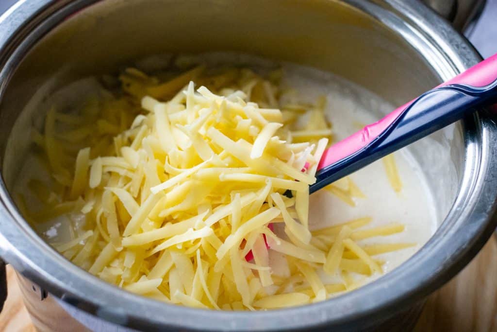 Grated Cheddar added to the sourdough white sauce.
