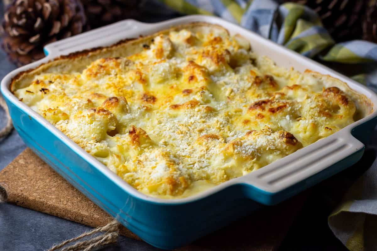 Baked Sourdough Cauliflower Cheese in a ceramic dish.