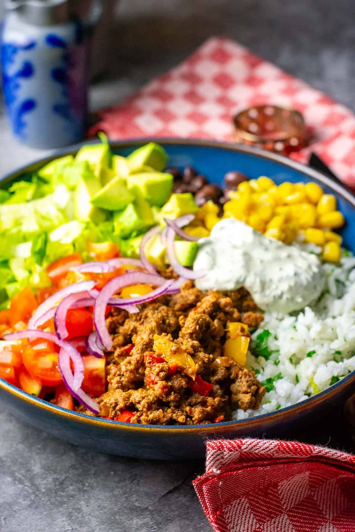 Assembled Beef Burrito bowl on a grey table top.
