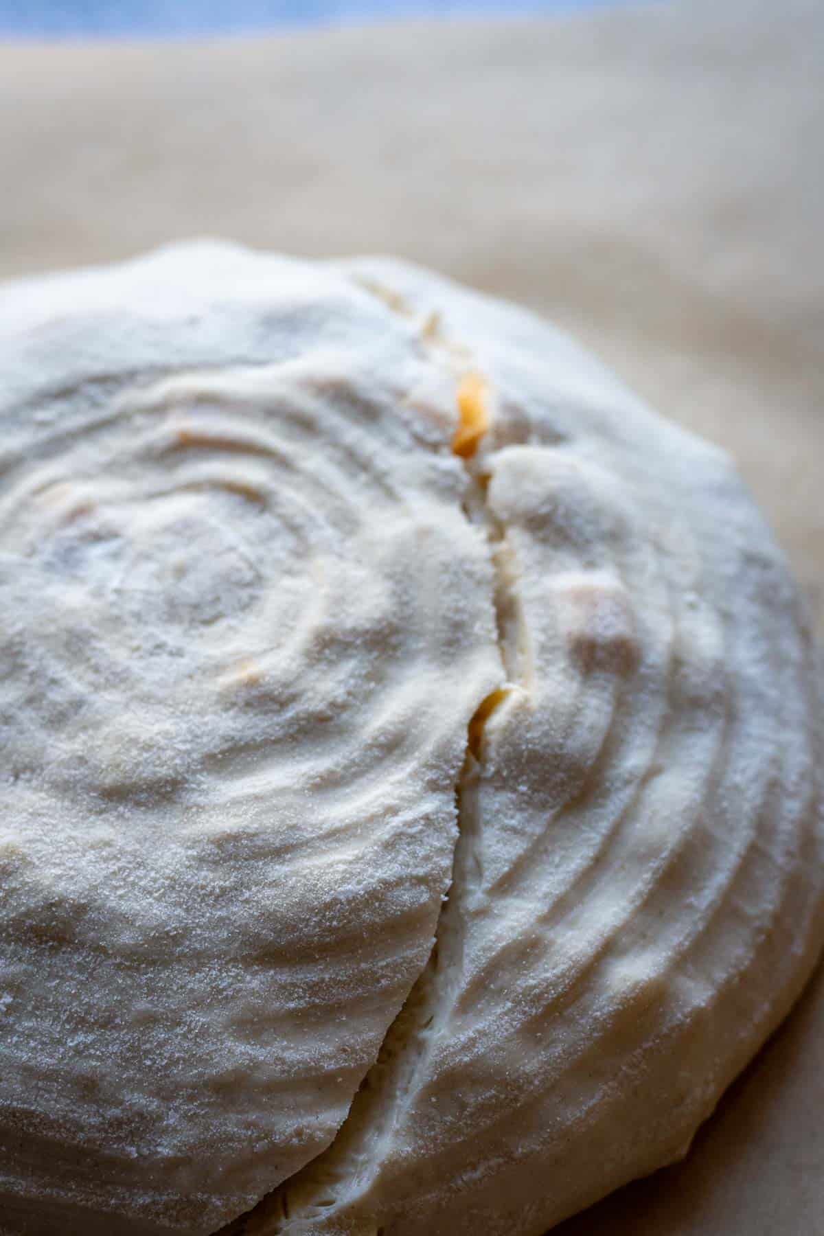 One slash across shaped sourdough before baking.