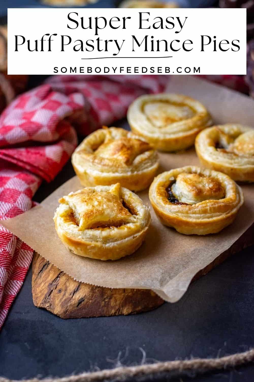 5 puff pastry mince pies arranged on a decorative wooden board. Pin for Pinterest.