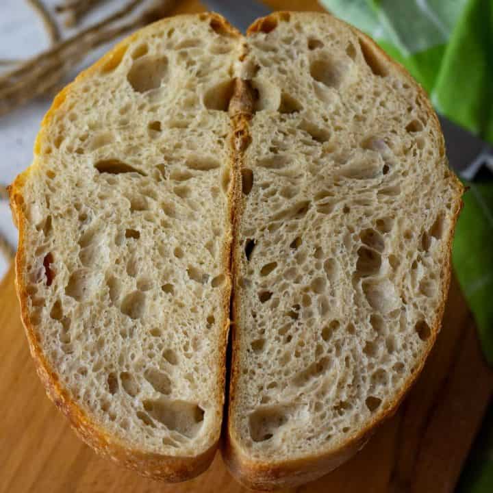 Sourdough bread cut in half exposing the crumb.
