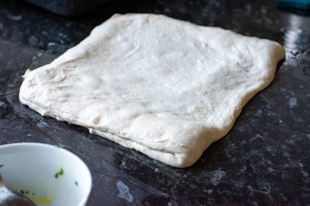 Sourdough folded over the garlic butter filling.
