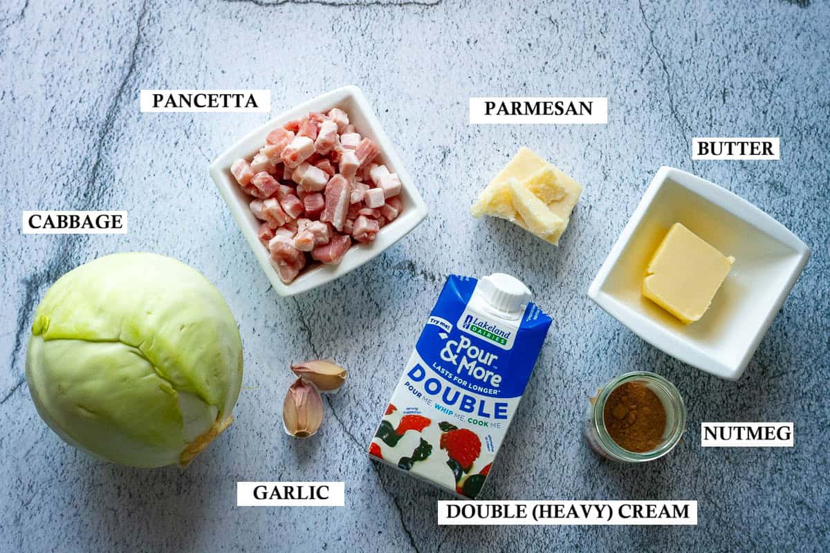 Ingredients for low-carb cabbage alfredo on a light surface.