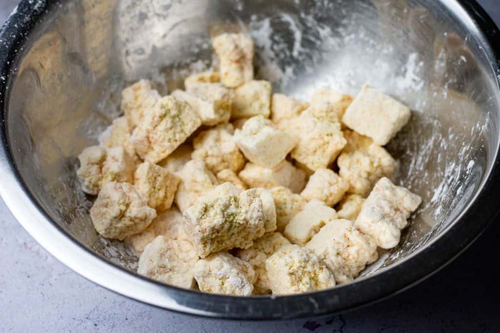 Tofu coated in cornflour mixture.