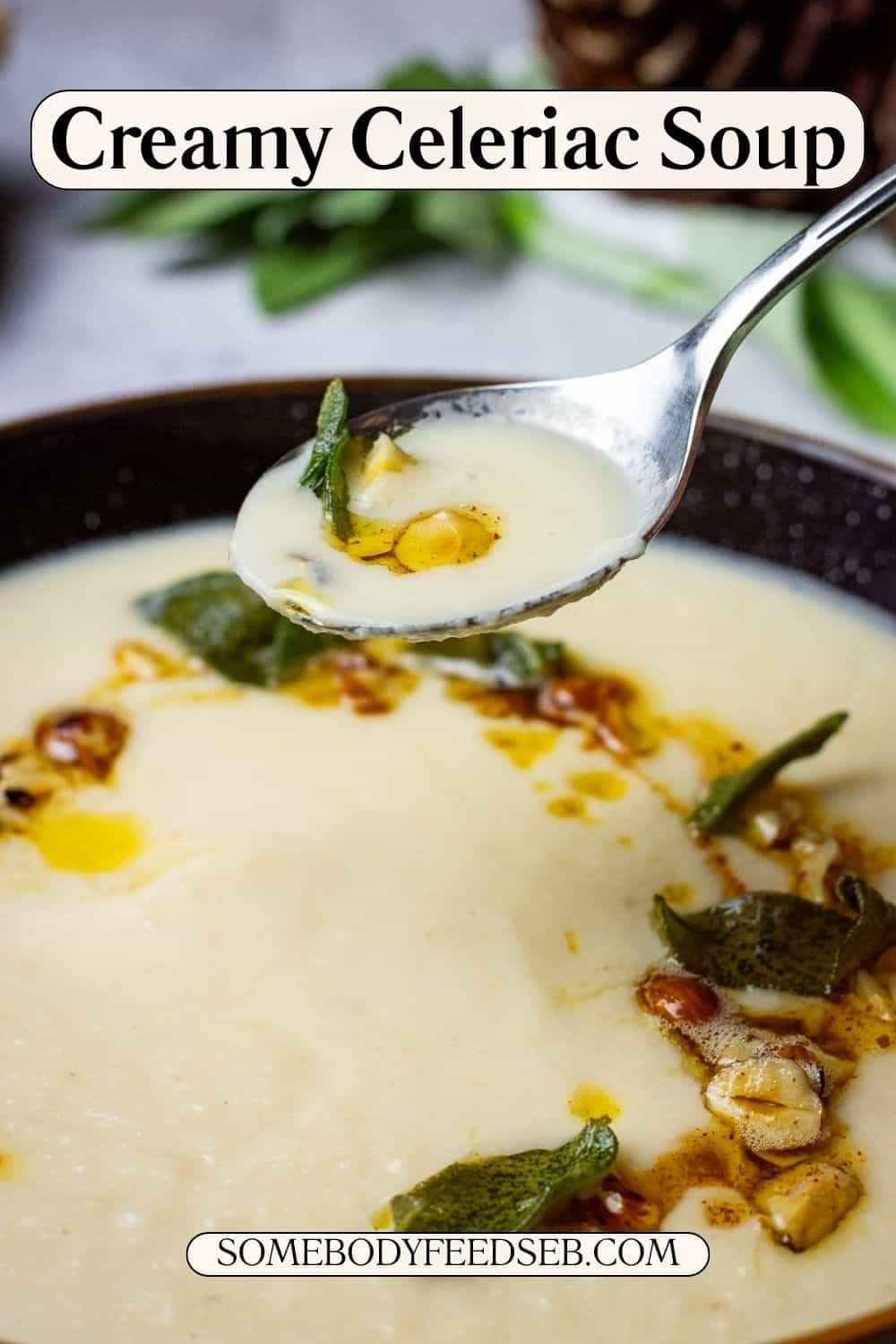 A spoonful of creamy celeriac soup being picked up form a bowlful with a swirl of browned butter, hazelnuts and crispy sage. Pin for Pinterest.