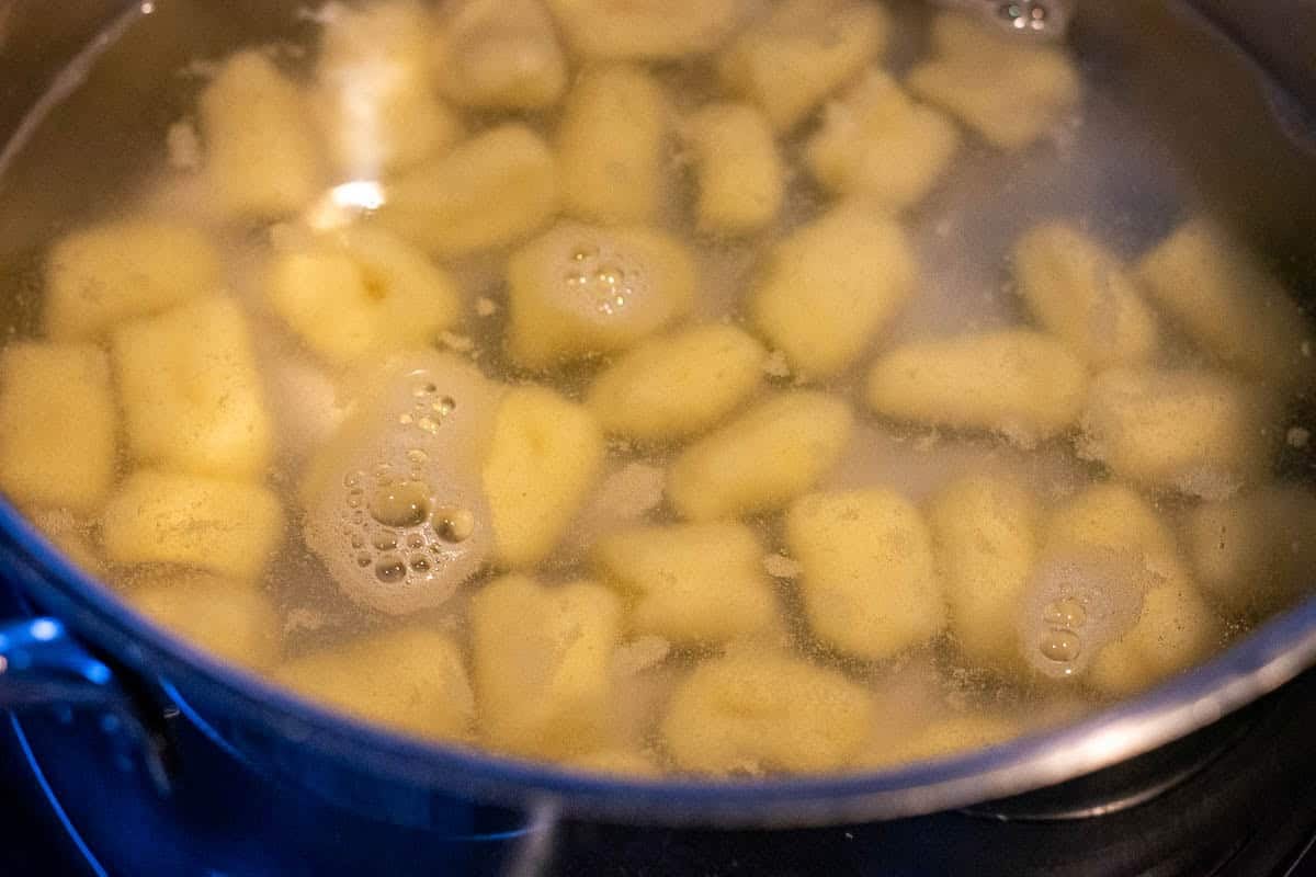 Gnocchi in a pan of water.