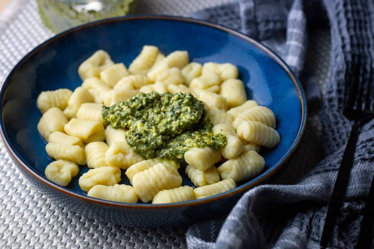 Sourdough gnocchi topped with basil pesto.