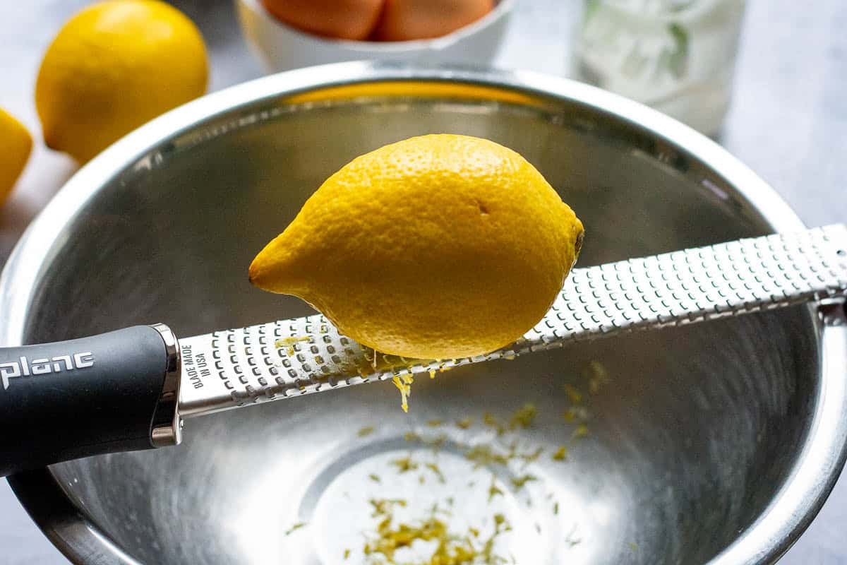 Using a microplane to zest lemons.