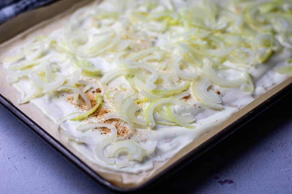Sourdough base topped with creme fraiche, nutmeg and sliced onions.