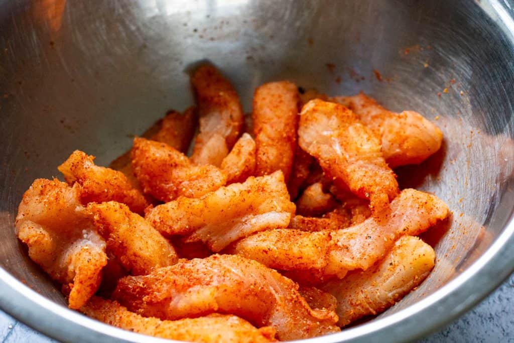 Fish tossed in the spice mix.