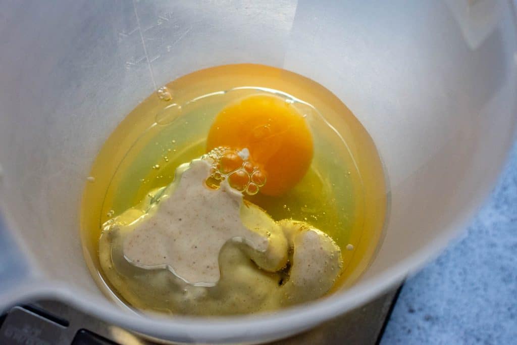 Wet ingredients being mixed in a small jug.