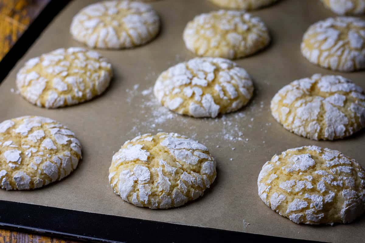 Sourdough Discard lemon discard cookies on a baking sheet lined with baking parchment.