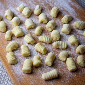 Sourdough Gnocchi on a floured wooden board.