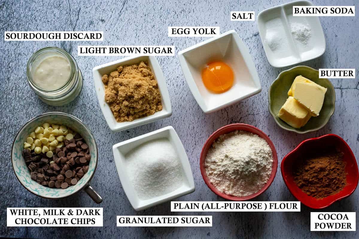 Labelled ingredients for Chocolate Sourdough Discard cookies on a grey surface.