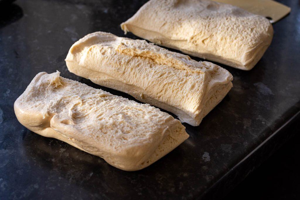 Evaporated milk sourdough divided into three pieces.